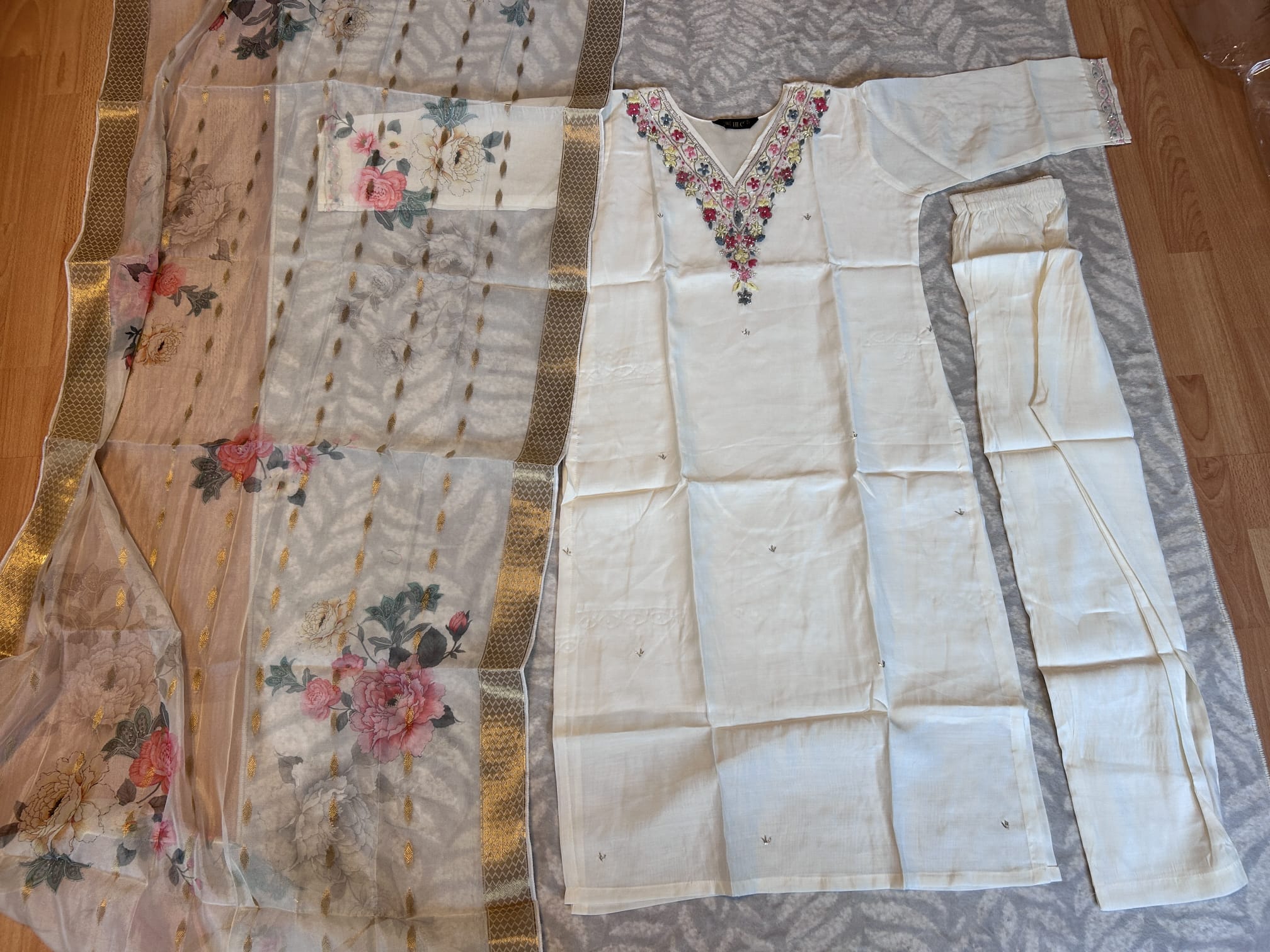 Cream colour v neck  kurta with trousers and printed organza shawl